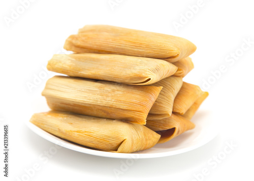Homemade Wrapped Tamales Isolated on a White Background photo
