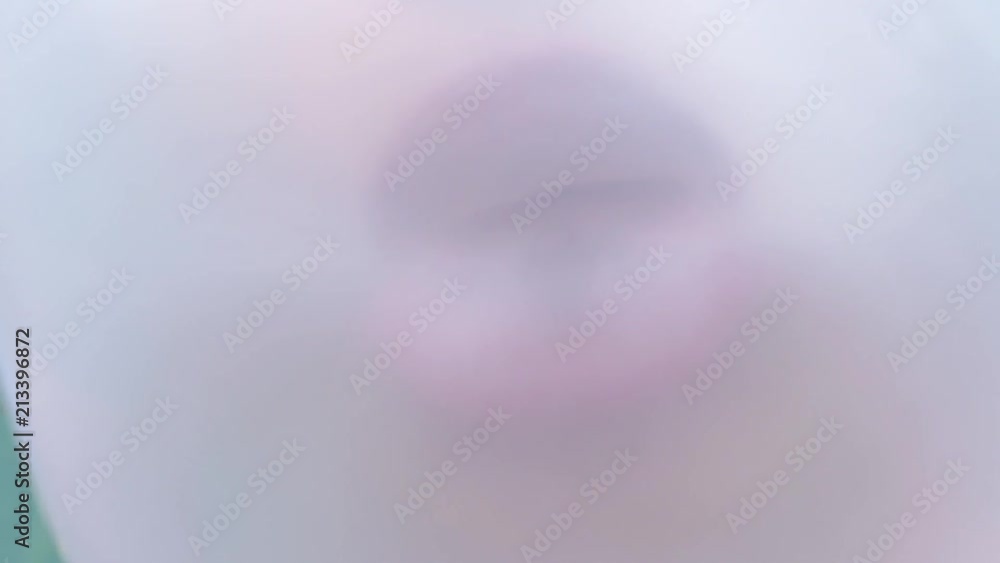 girl making a big, huge bubble from chewing gum, close girl making a big, huge bubble from chewing gum, close