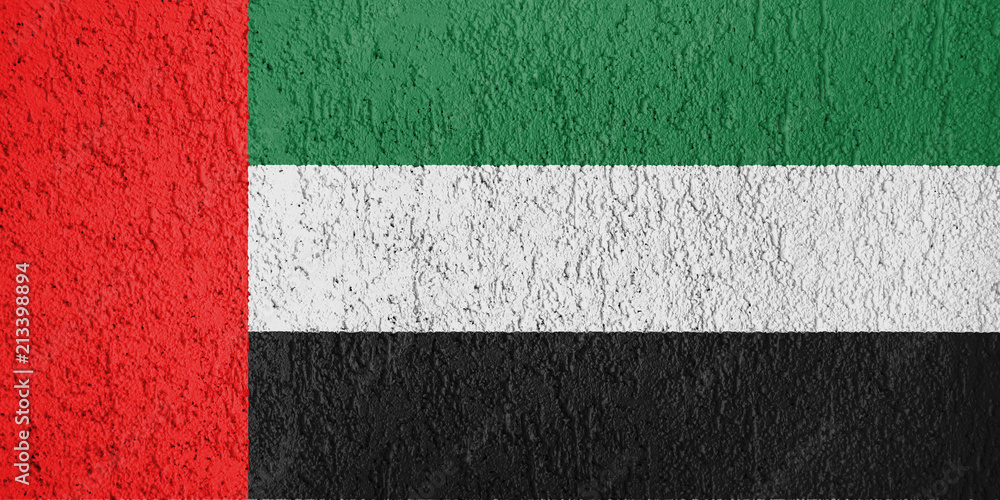 The texture of United Arab Emirates flag on the wall of the plaster. The texture of United Arab Emirates flag on the wall of the plaster.