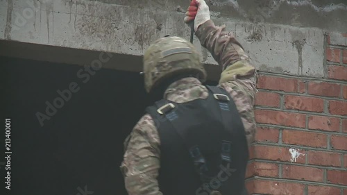 Subdivision anti-terrorist police during a black tactical exercises. Rope Techniques. Real situation.