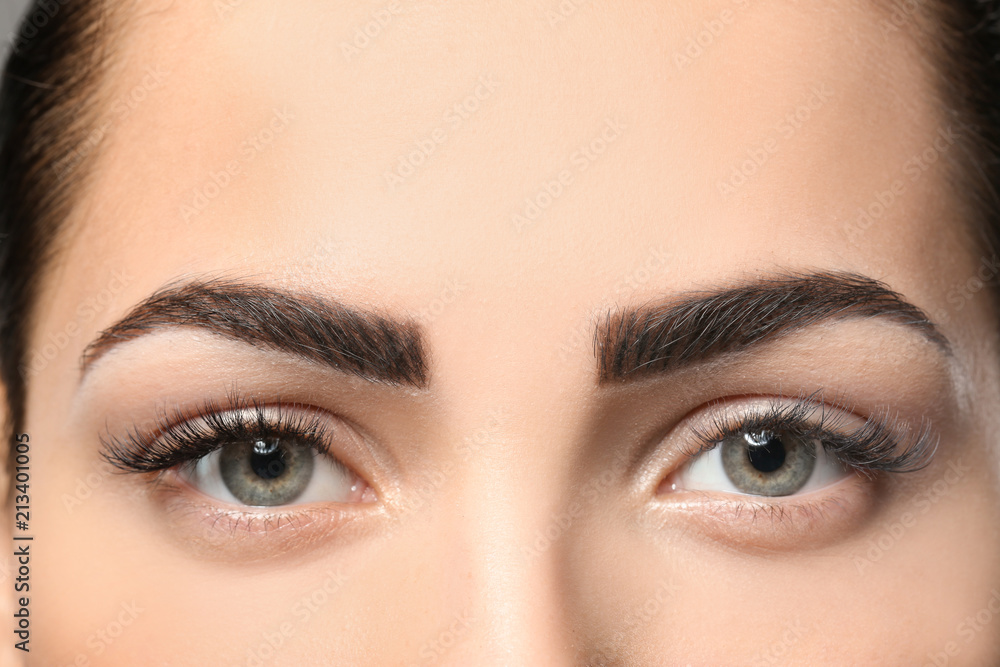 Young woman with permanent eyebrows makeup, closeup