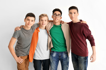 Group of cute teenagers on white background