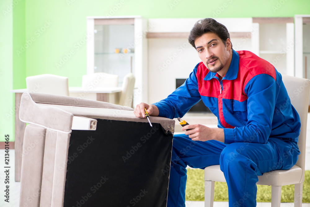 Repair contractor repairing broken furniture at home Repair contractor repairing broken furniture at home