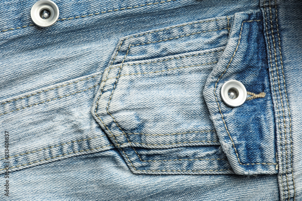 Closeup view of jean jacket pocket as background Closeup view of jean jacket pocket as background