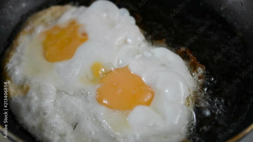 Fry two eggs in the pan, close up hd footage Fry two eggs in the pan, close up hd footage