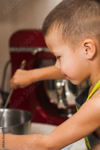 Small Boy cooking on the kitchen