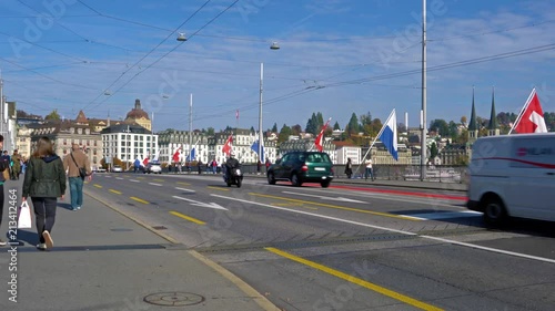 Buses and cars on the city road and old houses, Lucerne, Switzerland