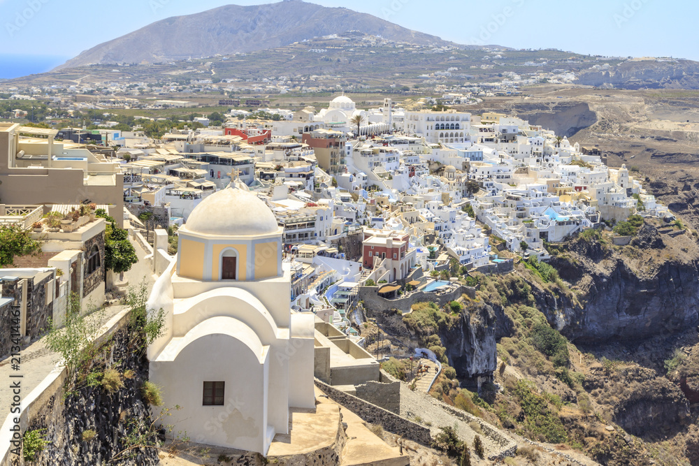 Thira town with St. Stylianos church during daytime in Santorini, Greece