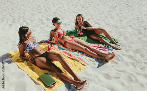 Women sunbathing on beach