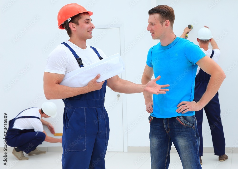 foreman and architect discussing construction project foreman and architect discussing construction project