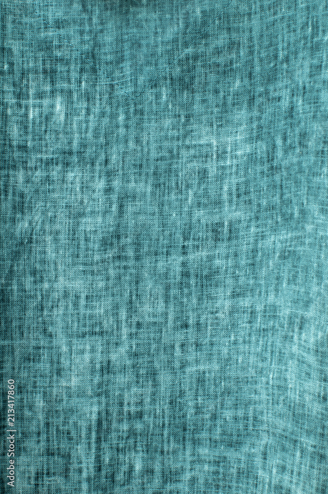 Texture of turquoise natural linen flax fabric closeup as textile background Texture of turquoise natural linen flax fabric closeup as textile background