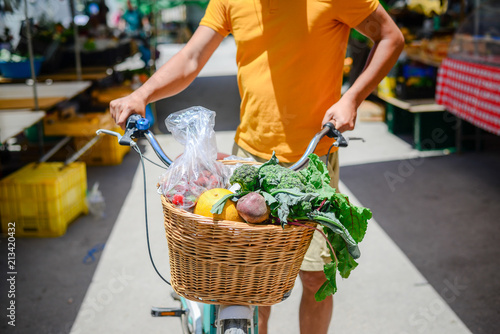 People buying fruits and vegetables. Summer outdoors farm market shopping background. Real purchasing selling natural healthy lifestyle candid closeup image