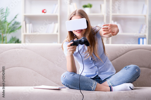 Young girl playing virtual reality games