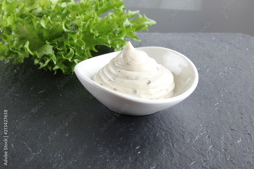 mayonnaise sauce, sour cream on a stone background mayonnaise sauce, sour cream on a stone background