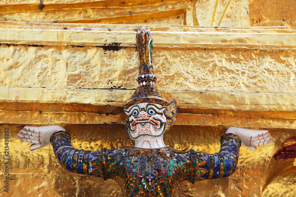demon statue which support golden chedi
