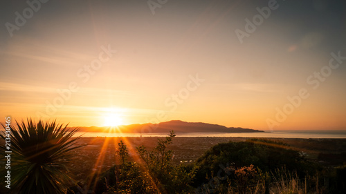 Sunset captured on the hills in Paraparaumu near Wellington, Kapiti coast, North Island of New Zealand. Kapiti Island in front photo