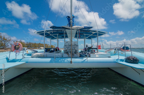 Blue Catamaran Floating On Turquoise Water