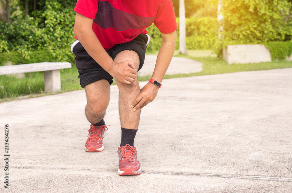 Man suffering from pain in leg injury after running Man suffering from pain in leg injury after running