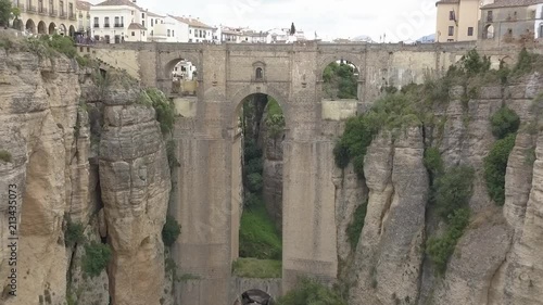 Aerial view of the historical Puente Nuevo Bridge, the newest and largest bridge that span the 120-metre-deep chasm that carries the Guadalevín River and divides the city of Ronda, in southern Spain.