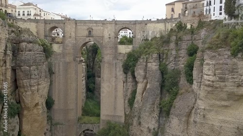 Aerial view of the historical Puente Nuevo Bridge, the newest and largest bridge that span the 120-metre-deep chasm that carries the Guadalevín River and divides the city of Ronda, in southern Spain.
