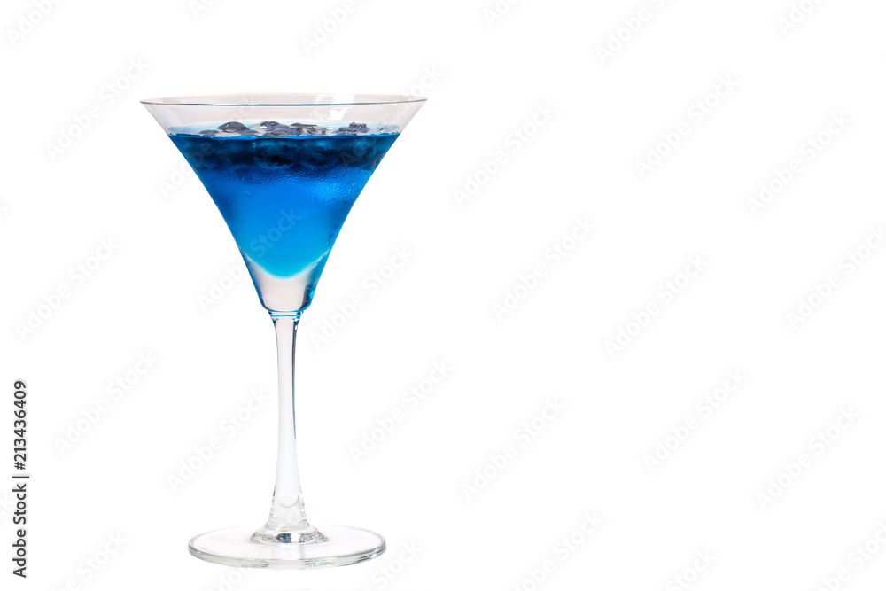 a glass of blueberry in blue water on white background with clipping path