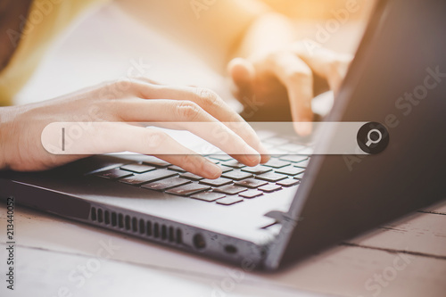 woman hand searching browsing internet data on computer notebook   photo