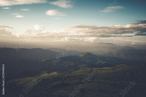 Beautiful mountain landscape under sky with clouds in sunlight. vintage filter effect.