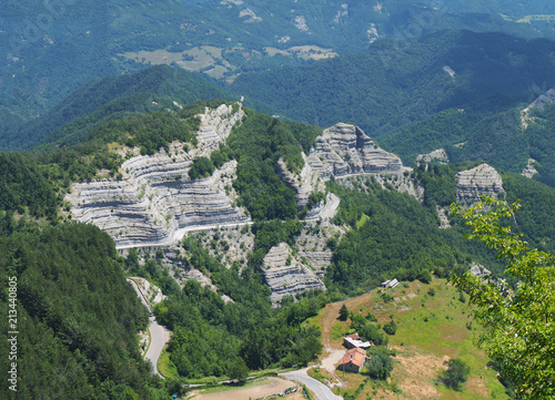 Italy. Scenic route to Mandrioli mountain pass. Landscape of walls made of sandstone and marl screeds named Scalacce. Tortuous curves photo