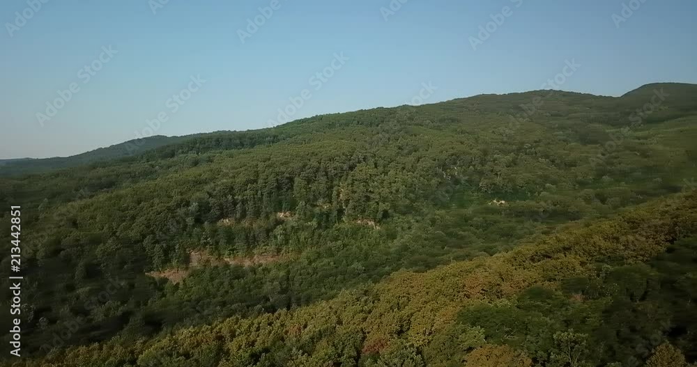Russian Forest And Mountains Under Blue Sky By Aerial Drone. Stunning Aerial Drone Stock Footage of South russian Forest And Mountains Under Blue Sky Russian Forest And Mountains Under Blue Sky By Aerial Drone. Stunning Aerial Drone Stock Footage of South russian Forest And Mountains Under Blue Sky