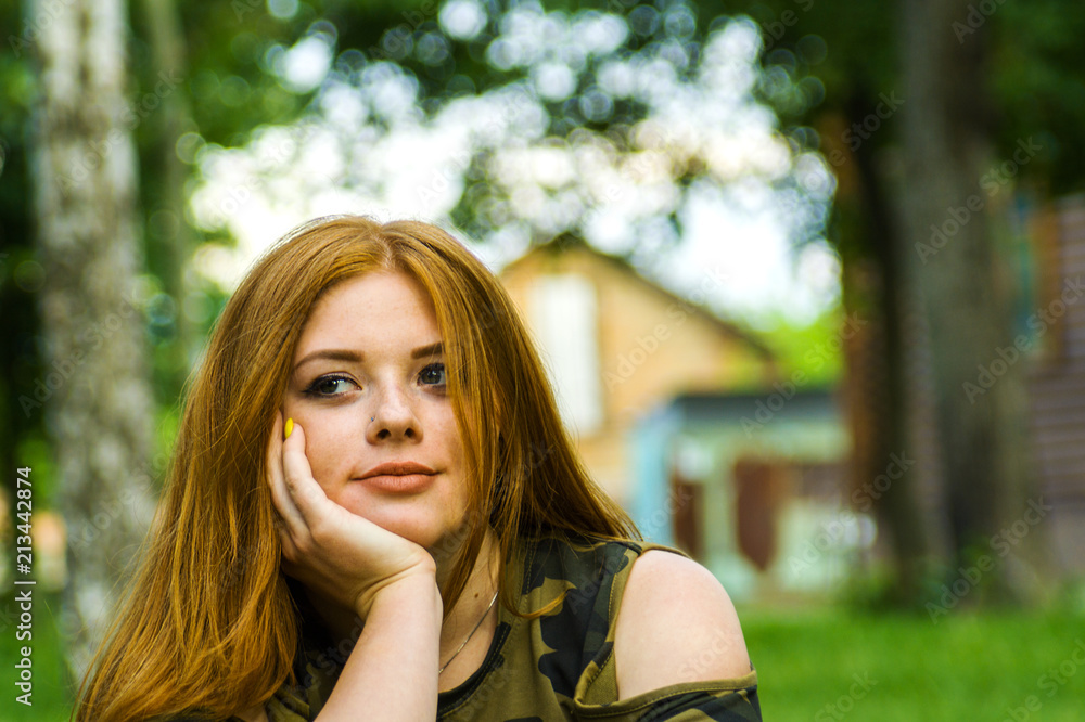 Pretty redhead girl shoot on outdoor park Pretty redhead girl shoot on outdoor park
