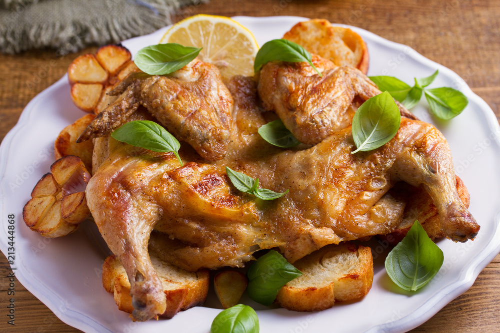 Spatchcock chicken on bread with lemon, basil and garlic Spatchcock chicken on bread with lemon, basil and garlic