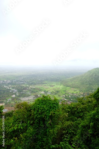  Green landscape surrounded by hills, mountains in monsoon season  © Sandeep
