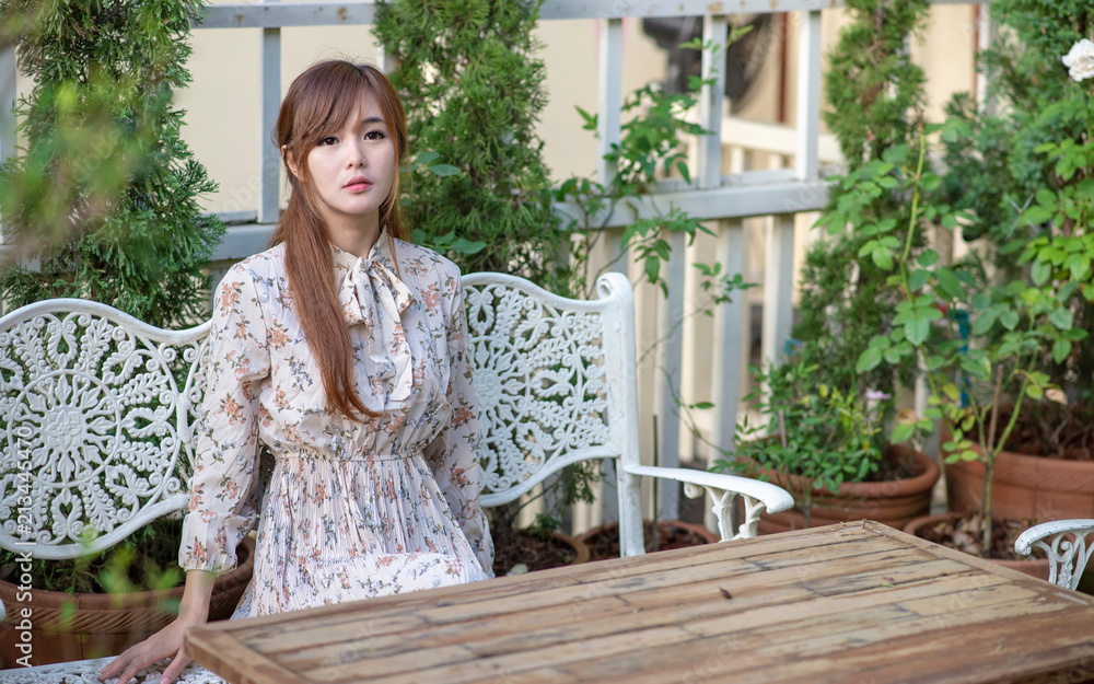 Fashionable dressed asian woman in the cafe. Fashionable dressed asian woman in the cafe.