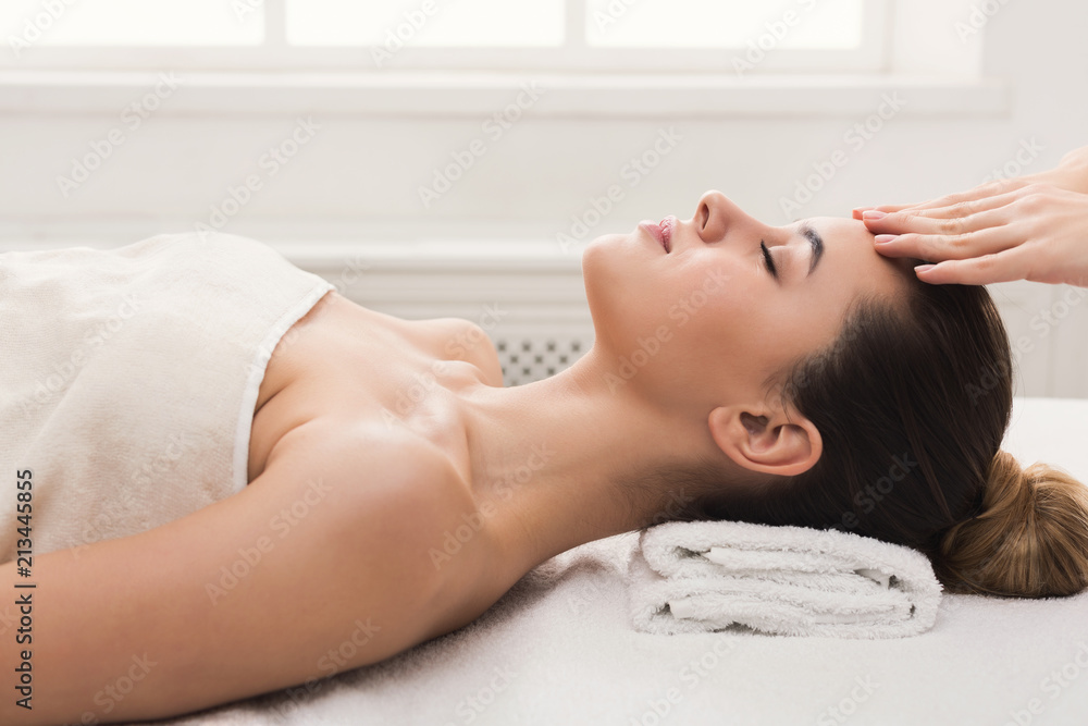 Woman getting professional facial massage at spa salon Woman getting professional facial massage at spa salon