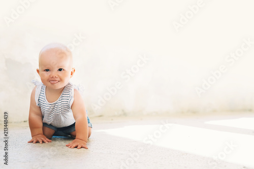 Little baby child outdoors in a european town.