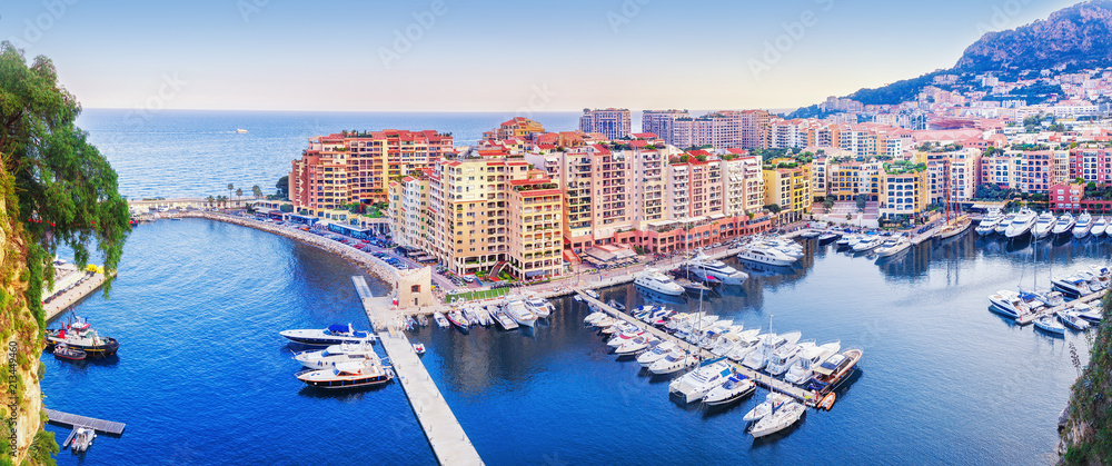 Monaco, Europe. Panoramic scenic view on fashionable apartment district and port Fontvieille in Monaco - small country, symbol of wealth and richness. Beautiful evening skyline of Monaco.