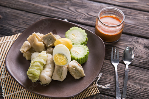 siomay. traditional indonesian food with peanut sauce photo