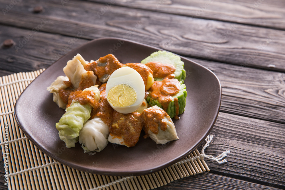 siomay. traditional indonesian food with peanut sauce siomay. traditional indonesian food with peanut sauce