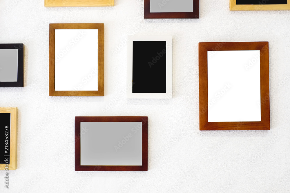Blank wooden square photo frame modern interior design decorated on white wall background with copy space for text or image. Blank wooden square photo frame modern interior design decorated on white wall background with copy space for text or image.