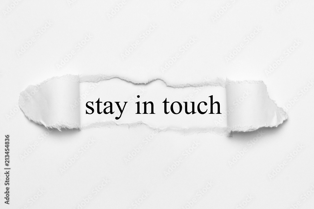 stay in touch on white torn paper stay in touch on white torn paper