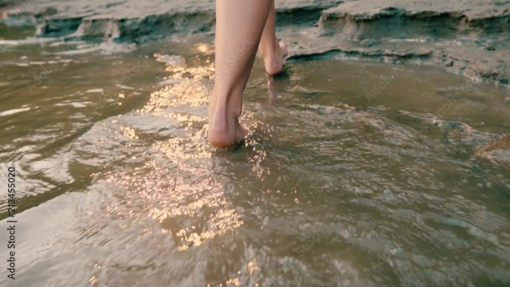 A girl walking up to a lonely beach. A girl walking up to a lonely beach.