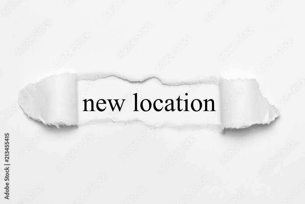new location on white torn paper new location on white torn paper
