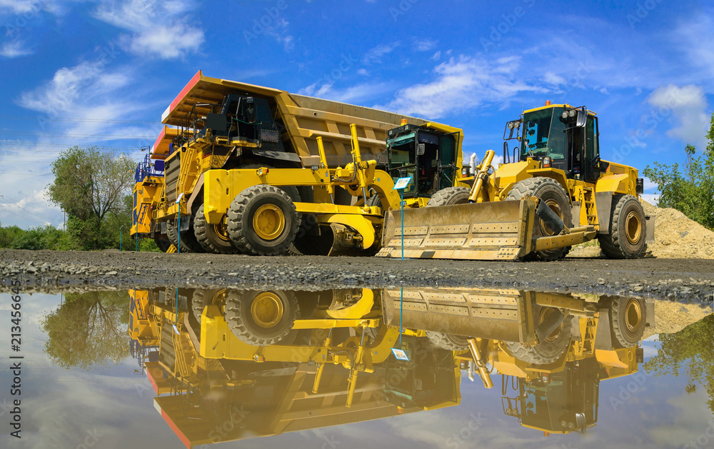Group of working heavy equipment at open pit Group of working heavy equipment at open pit