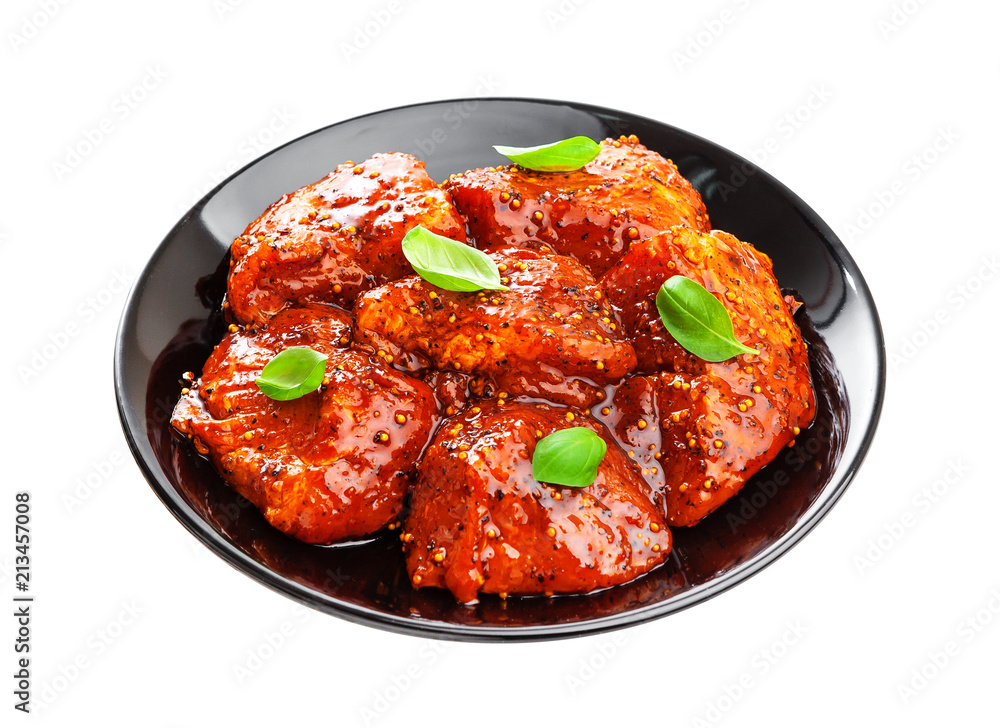 Uncooked shish kebab on plate. Raw marinated barbecue isolated on white background Uncooked shish kebab on plate. Raw marinated barbecue isolated on white background