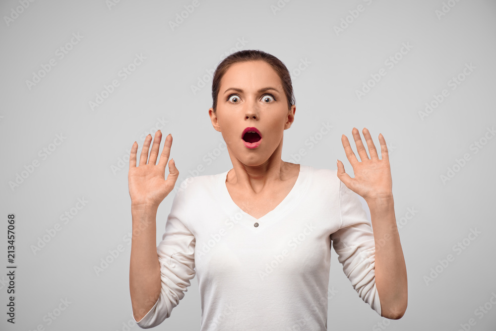 Portrait of stunned fascinated young mixed race woman with eyes popped out  and mouth dropped, looking at camera in surprise, shocked with astonishing  unexpected news. having shocked look Stock Photo | Adobe