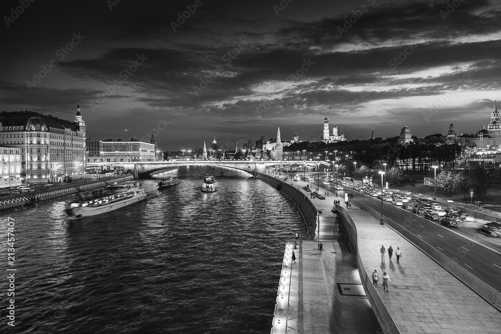 Urban night background, Moscow, the capital of Russia. Embankment in the city center, view of the river and the historic center of the city