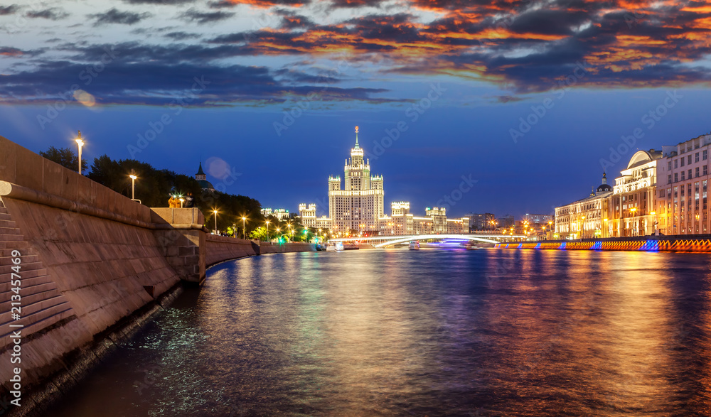 Urban night background, Moscow, the capital of Russia. Embankment in the city center, view of the river and the historic center of the city