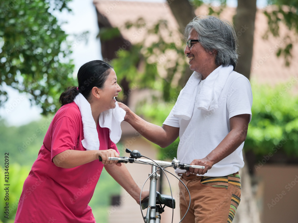 Senior couple lover cyling in Park.Health care concept. Senior couple lover cyling in Park.Health care concept.