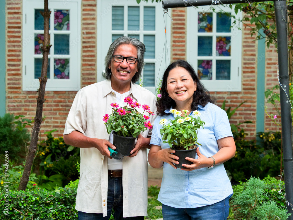 Portrait of couple senior in the flower garden