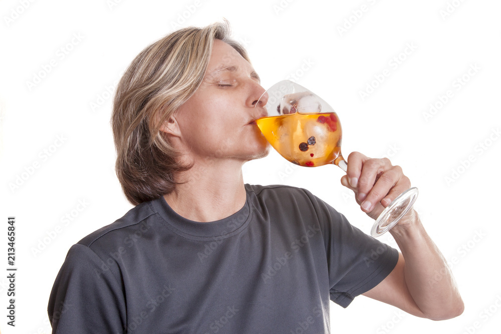 Woman drinking fruit juice with ice and berries. Isolated on white background. Woman drinking fruit juice with ice and berries. Isolated on white background.
